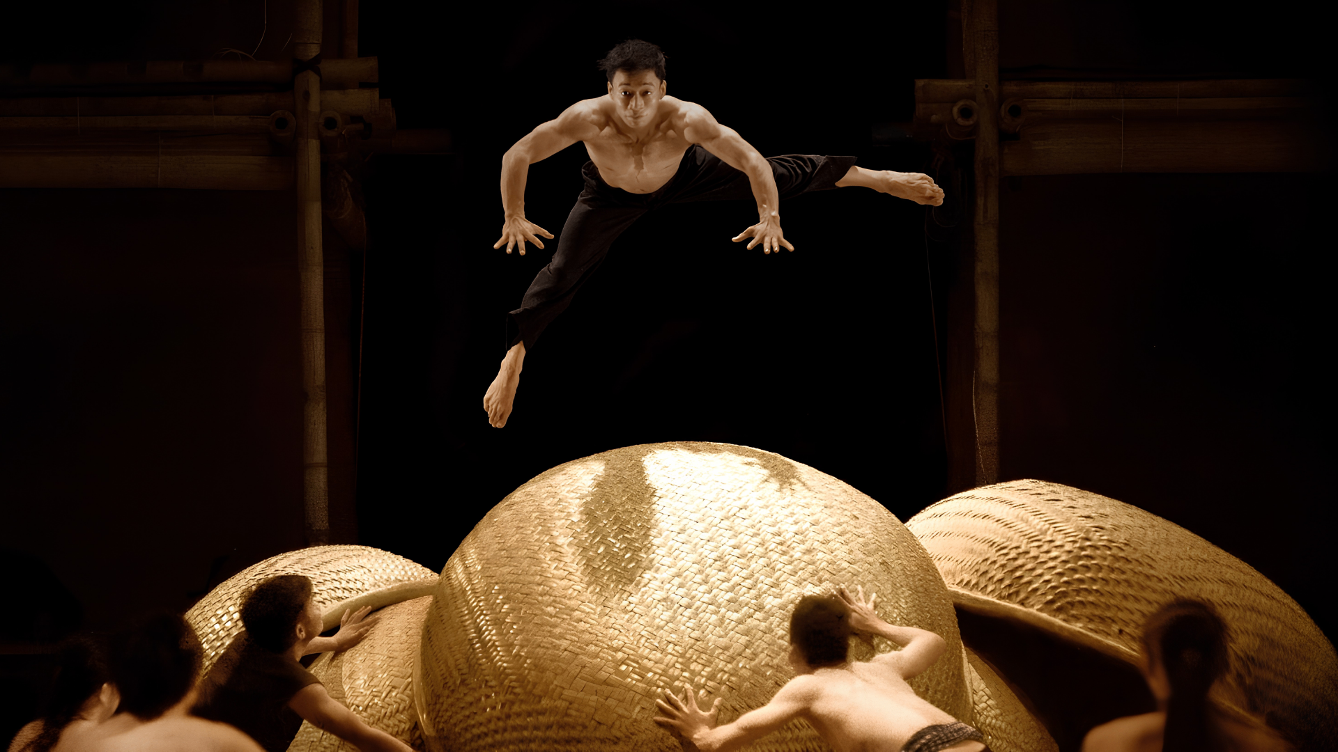 Performer mid-air at the À Ố Show.